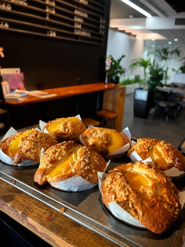 Golden muffins on a tray at Native Cafe